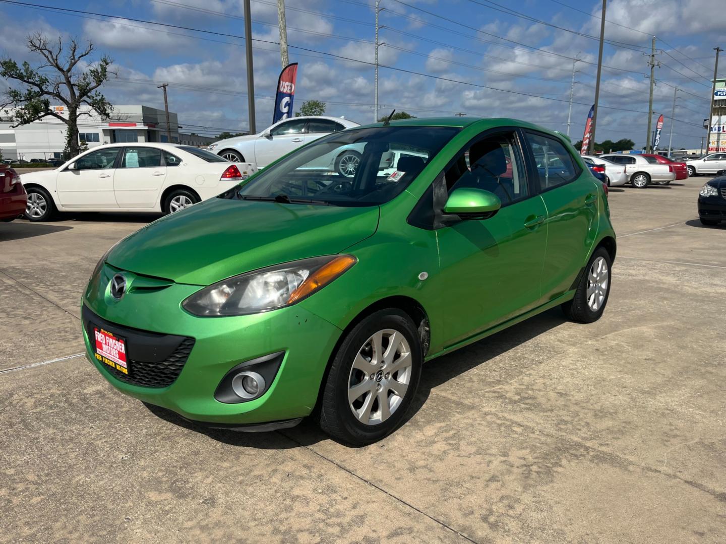 2013 green /black Mazda MAZDA2 Touring (JM1DE1LY1D0) with an 1.5L L4 DOHC 16V engine, Automatic transmission, located at 14700 Tomball Parkway 249, Houston, TX, 77086, (281) 444-2200, 29.928619, -95.504074 - Photo#2